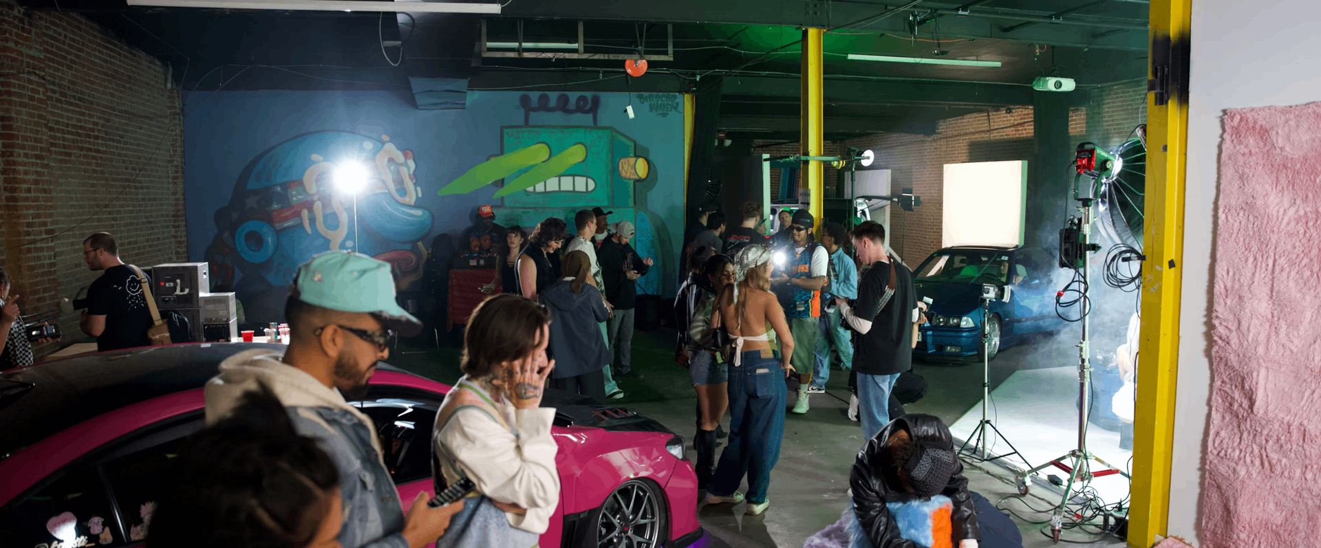 Event night — projection, haze, gathered creators